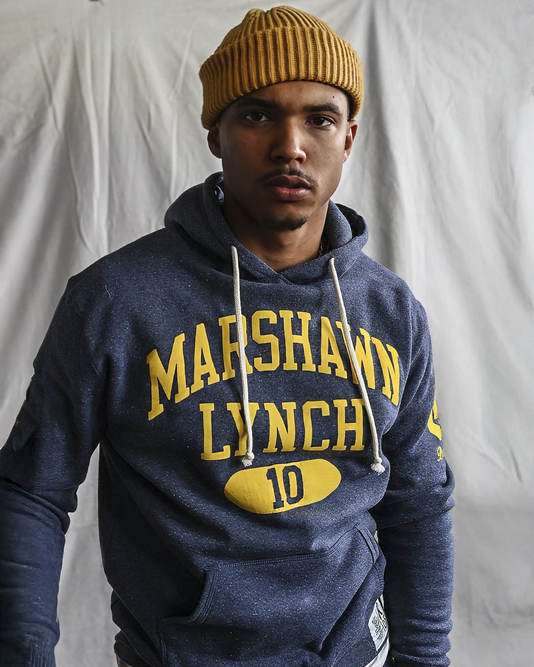 CAL - Marshawn Lynch 10 Navy PO Hoody - Roots of Fight Canada