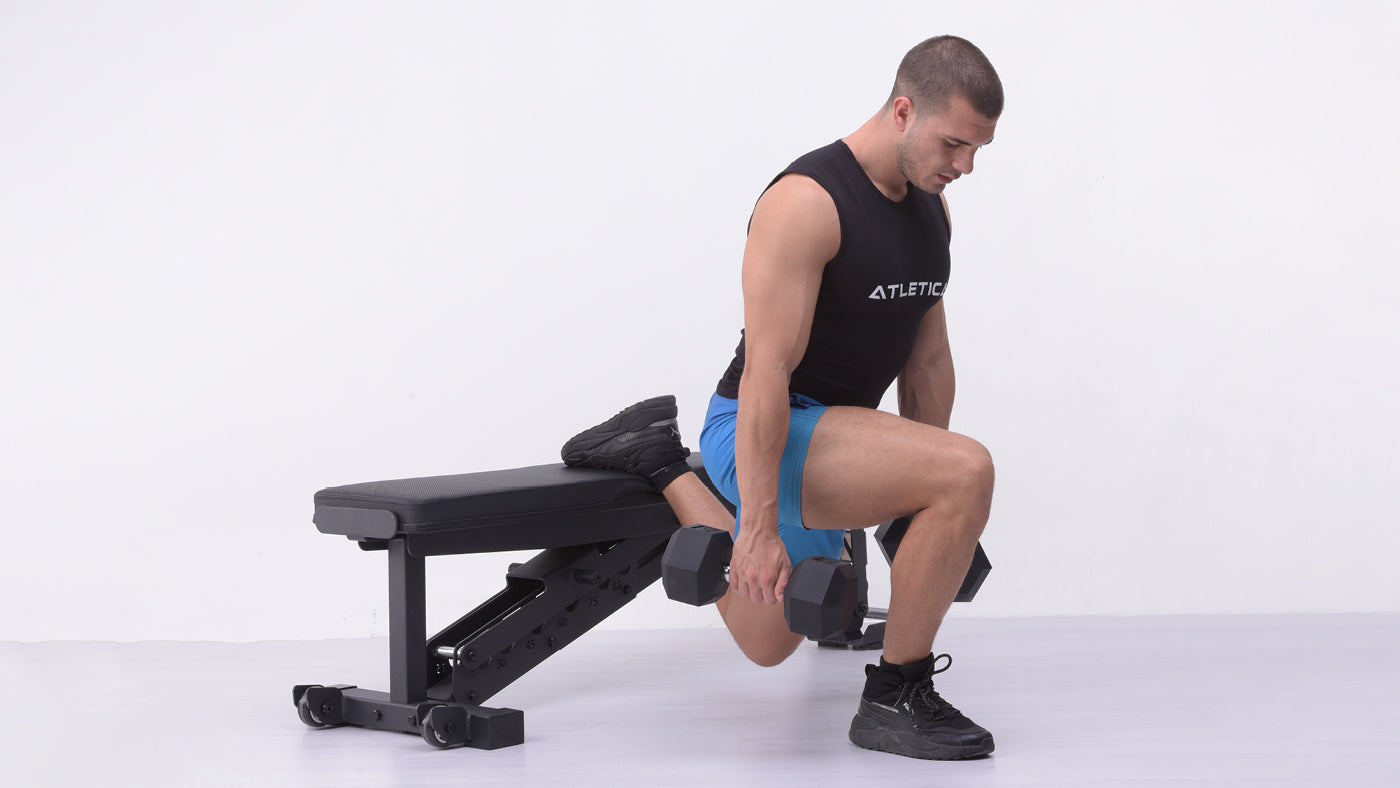 Bulgarian split squats on the weight bench with dumbbells