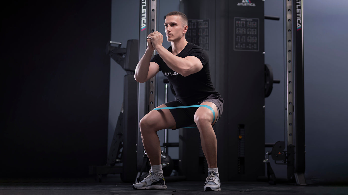 Kniebeuge mit Widerstandsbändern