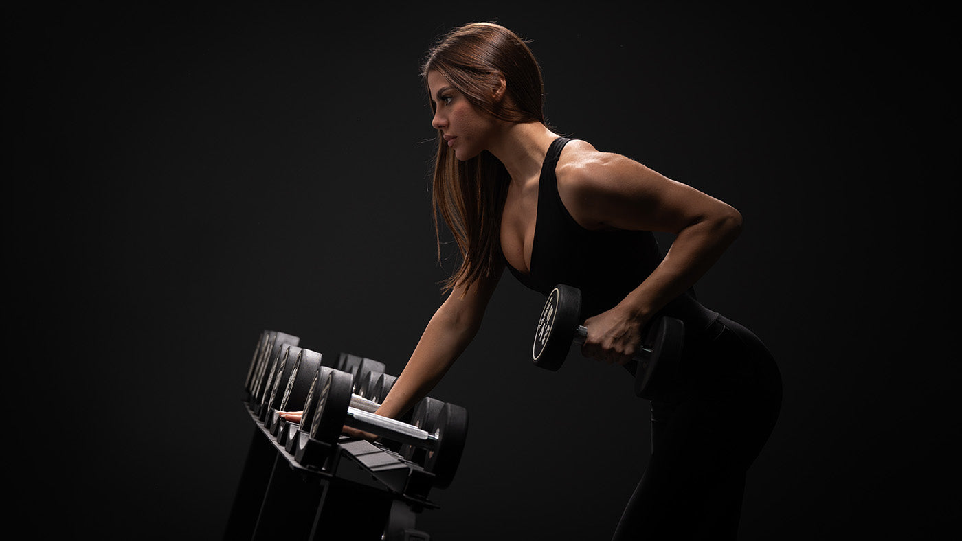 Atletica dumbbells on a dumbbell rack