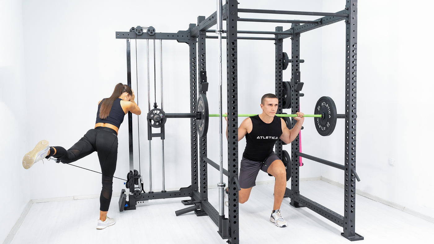 Squats on the multi-press of the multi-gym