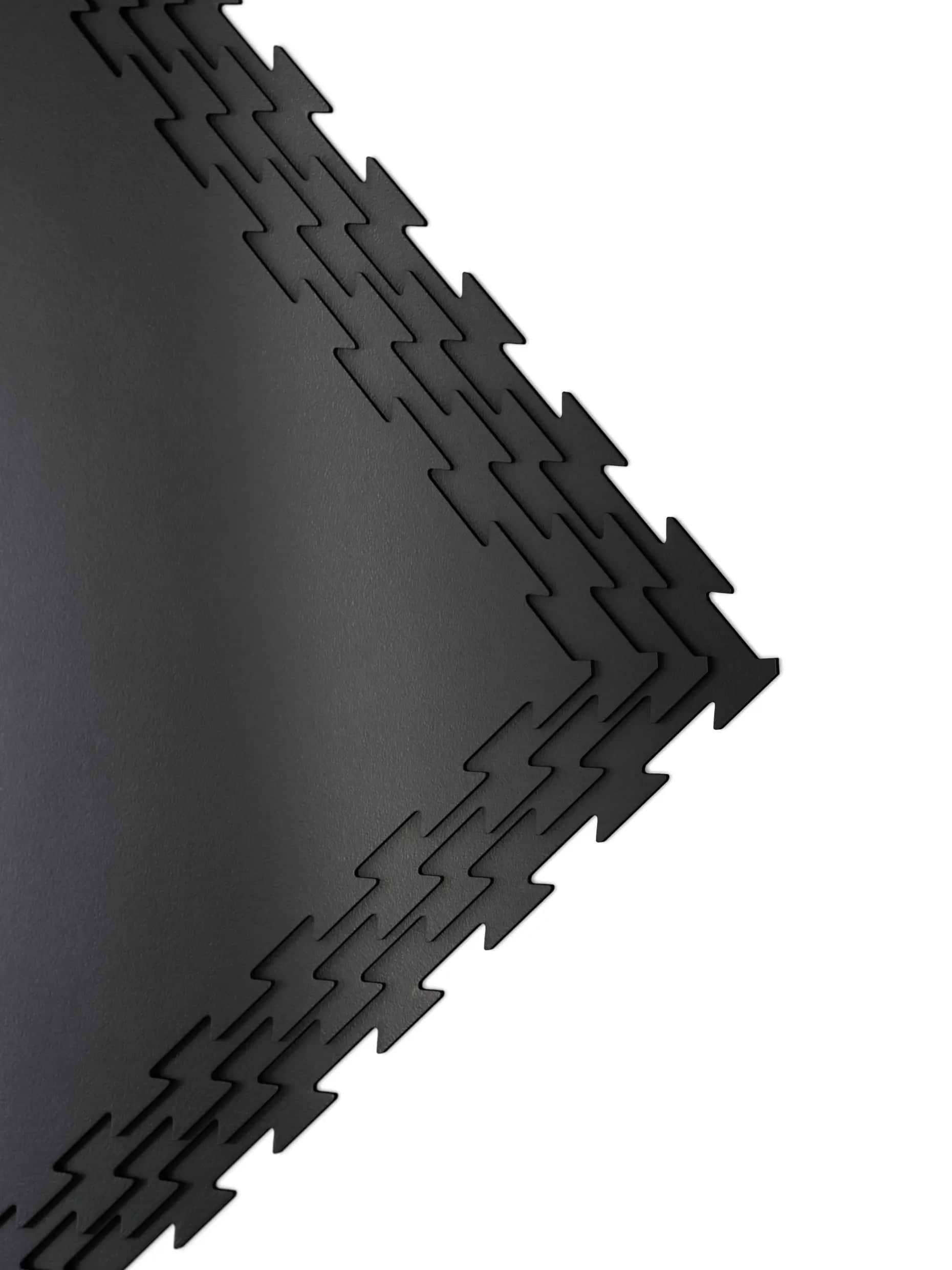 ATLETICA FlexProtect Puzzlematte 10mm – Nahaufnahme gestapelte Matten mit Puzzle-Verbindungsprofil und 10mm Materialstärke