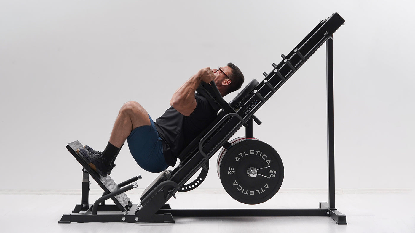 Seated overhead press on a plate-loaded strength machine