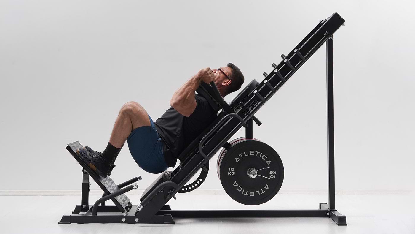 Seated overhead press on a plate-loaded strength machine