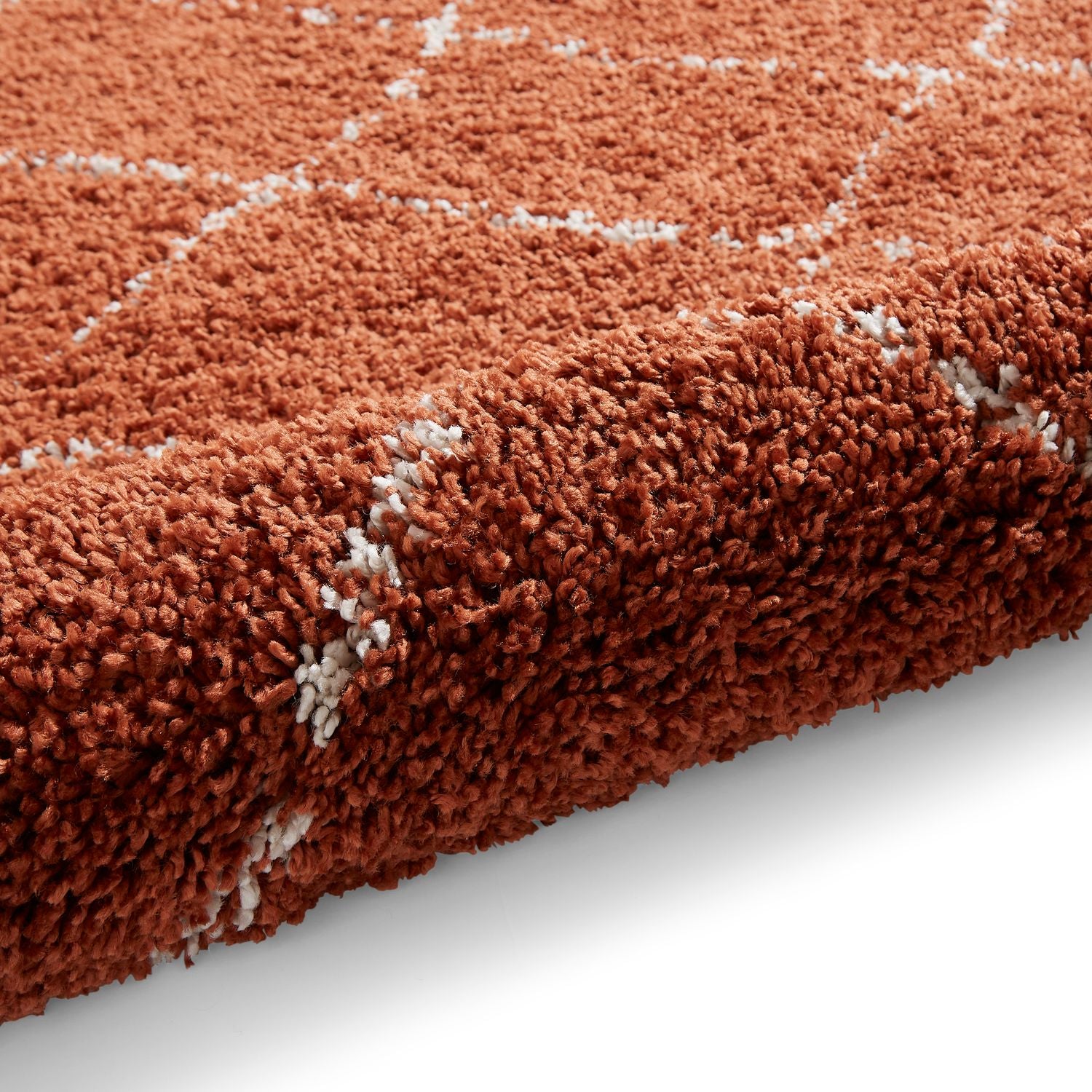 Rust Willow Shaggy Tasselled Diamond Rug from Roseland Furniture