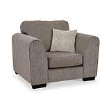 Thornby Standard Armchair Mink Natural from Roseland Furniture postitioned at an angle highlighting the black legs and textured details of the armchair with simple piping around the edges and a mink cushion