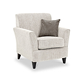 Thornby Accent Chair Natural Mink from Roseland Furniture postitioned at an angle highlighting the black legs and textured details of the armchair with simple piping around the edges and a brown cushion