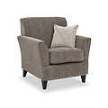 Thornby Accent Chair Mink Naural from Roseland Furniture postitioned at an angle highlighting the black legs and textured details of the armchair with simple piping around the edges and a mink cushion