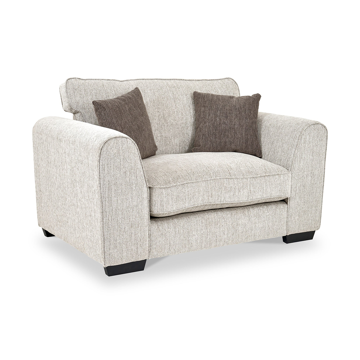 Thornby Snuggle Armchair Natural Mink from Roseland Furniture postitioned at an angle highlighting the black legs and textured details of the armchair with simple piping around the edges and 2 brown cushions