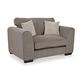 Thornby Snuggle Armchair Mink Natural from Roseland Furniture postitioned at an angle highlighting the black legs and textured details of the armchair with simple piping around the edges and 2 cream cushions