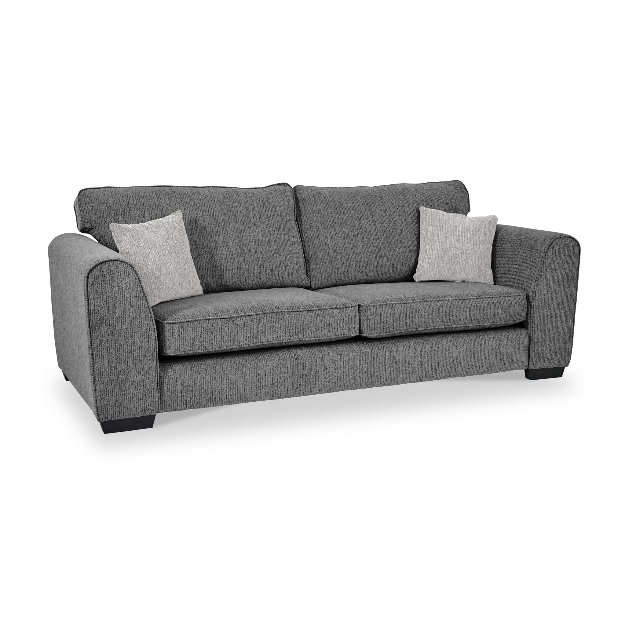 Thornby 4 Seater Sofa Charcoal Light Grey from Roseland Furniture postitioned at an angle highlighting the black legs and textured details of the sofa with simple piping around the edges and two cream cushions.