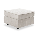 Thornby Standard Footstool Natural from Roseland Furniture positioned at an angle to display the black legs and the texture of the footstool