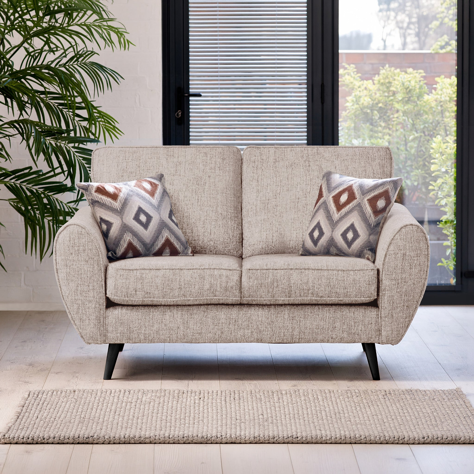 Northwick 2 Seater Sofa Beige with Dark Leg from Roseland Furniture