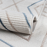 Close-up of a textured rug with geometric pattern