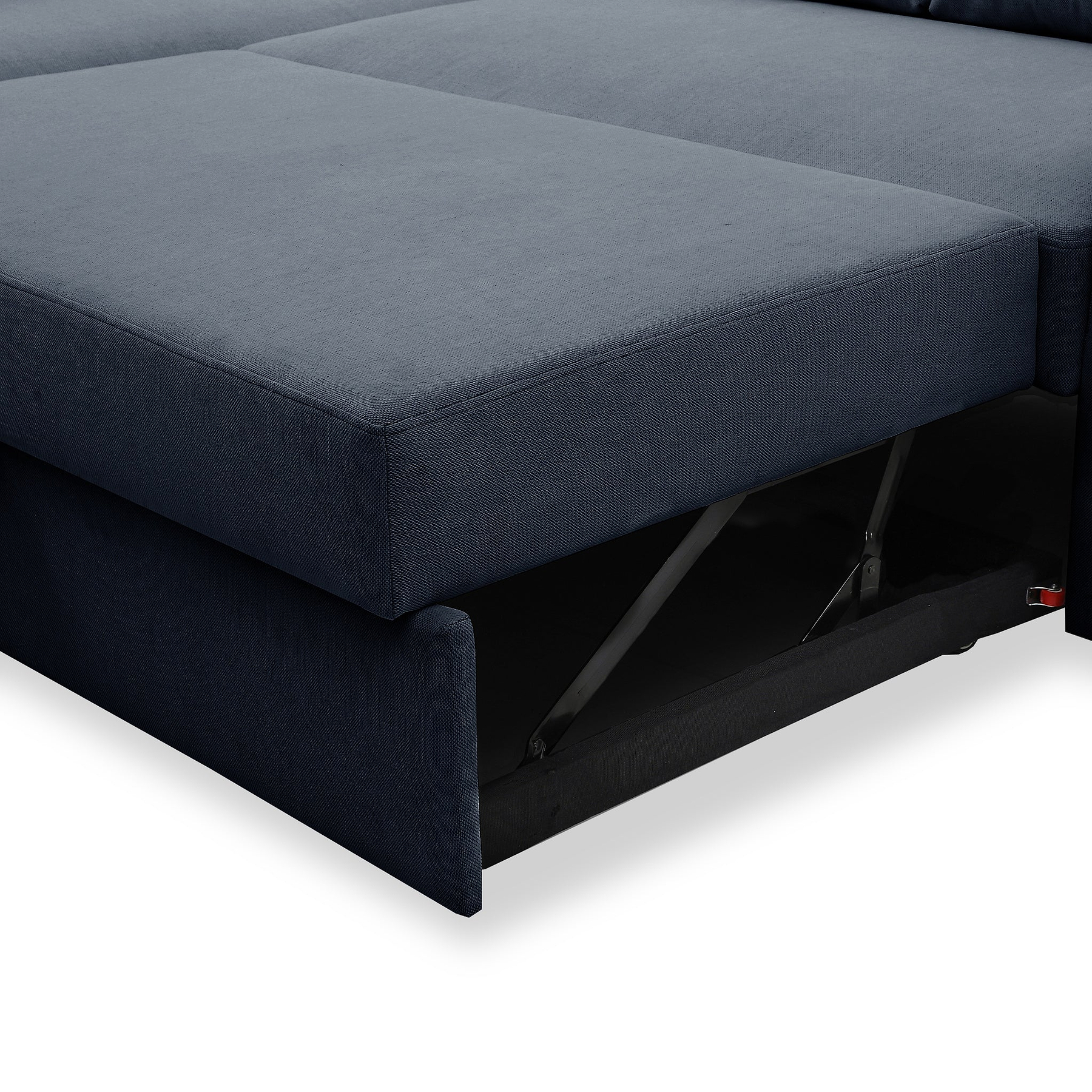 A dark blue sofa with one section lifted, revealing a hidden storage compartment beneath, isolated against a white background.