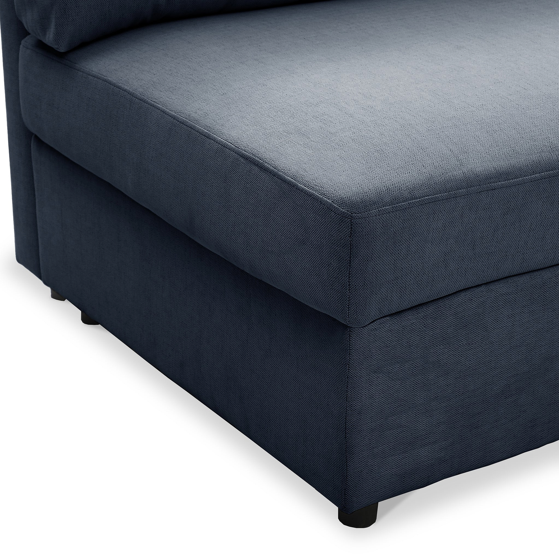 A navy blue fabric ottoman with a cushioned top and black legs, set against a white background.