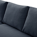 A grey fabric sofa with a cylindrical cushion resting on its surface, set against a neutral background.
