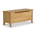 A wooden oak toy box with a hinged lid and panelled sides, set against a white background.