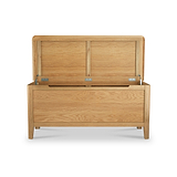 Wooden chest with open lid, showcasing metal hinges, set against a white background.