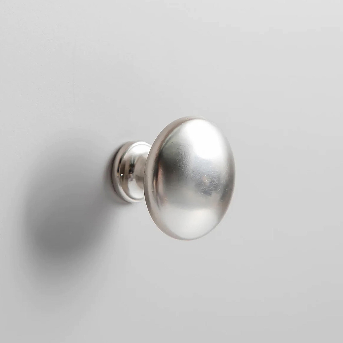 Farrow XL Grey 2 Over 3 Chest Of Drawers from Roseland Furniture - close up of silver knobs