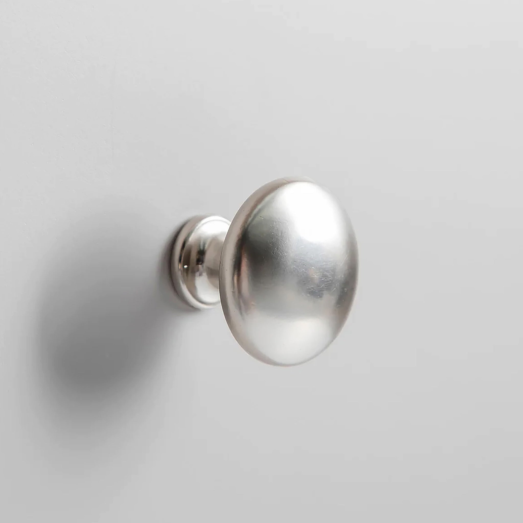 Farrow XL Grey 2 Over 3 Chest Of Drawers from Roseland Furniture - close up of silver knobs