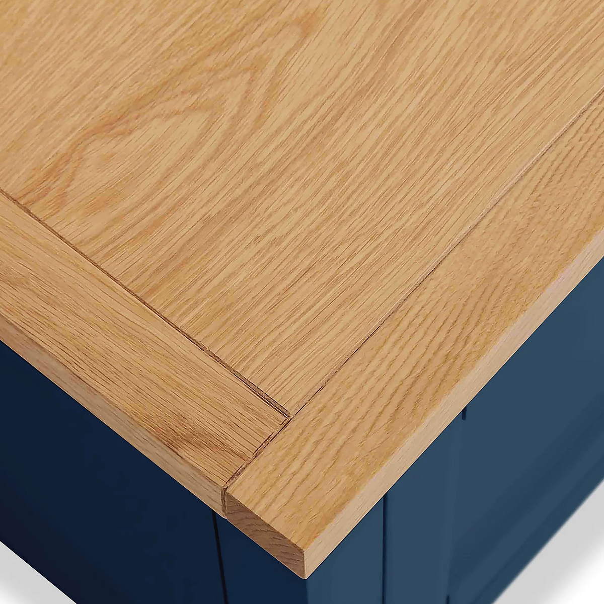 Farrow XL Navy 2 Over 3 Chest Of Drawers from Roseland Furniture - close up of wooden top