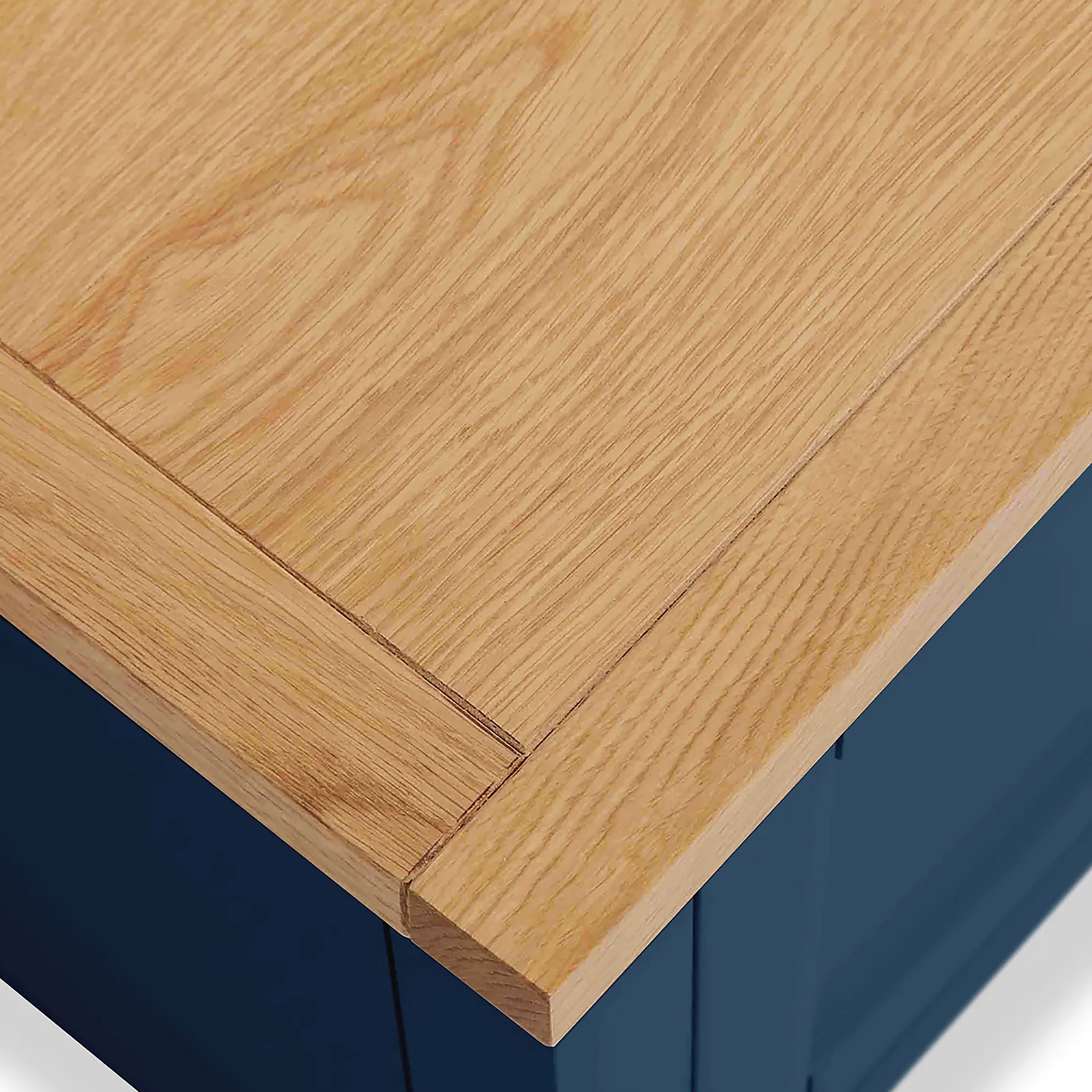 Farrow XL Navy 2 Over 3 Chest Of Drawers from Roseland Furniture - close up of wooden top