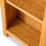 Lanner Oak Narrow Bookcase from Roseland Furniture