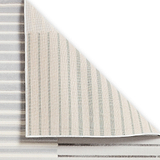 A striped carpet is partially rolled up to reveal its underside, set against a white background.