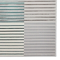 A patterned rug is displayed with alternating stripes in teal, brown, and shades of gray, creating a textured visual effect against a neutral background.