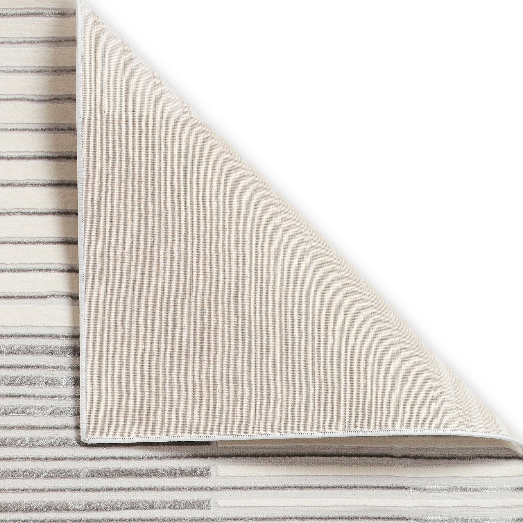 A beige carpet partially rolled up, revealing a striped pattern underneath, isolated on a white background.