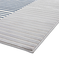 A grey and white striped rug rests flat on a white surface, depicting a clean, modern look.