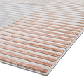 Striped rug with alternating beige and gray bands laid flat on a white surface, viewed at an angle.