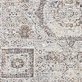 A textured fabric with an intricate pattern in shades of white, beige, and brown. It appears to be a close-up of a carpet or rug.
