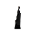 A sleek black smartphone is propped at an angle against a slanted stand, isolated on a white background.