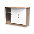 A wooden TV stand with white sliding doors and circular cutouts for handles, isolated on a white background.