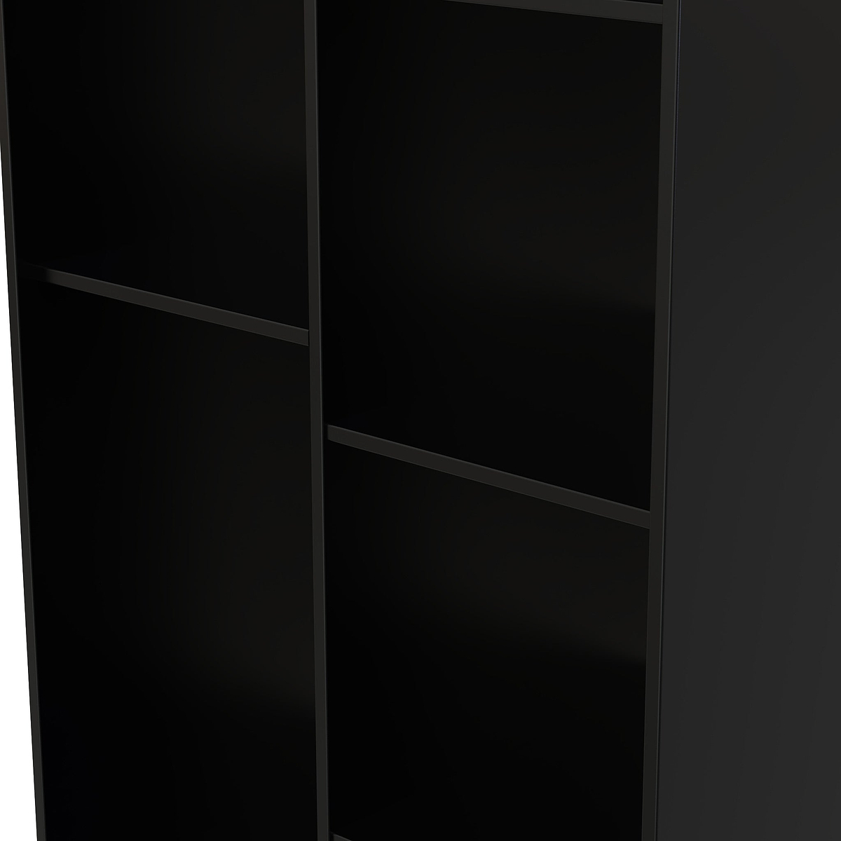 A tall, black, empty bookshelf with multiple shelves, partially lit at the edge, standing against a dark background.