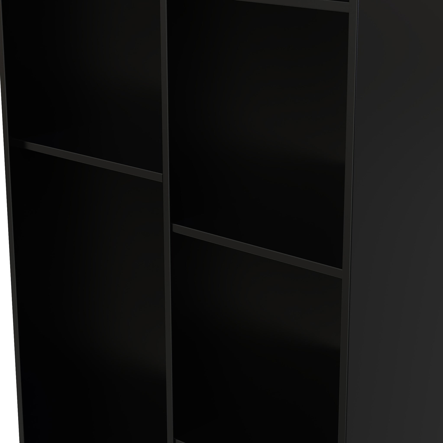 A tall, black, empty bookshelf with multiple shelves, partially lit at the edge, standing against a dark background.