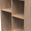 Empty wooden bookshelf with two vertical partitions and horizontal shelves, creating six compartments, isolated on a white background.