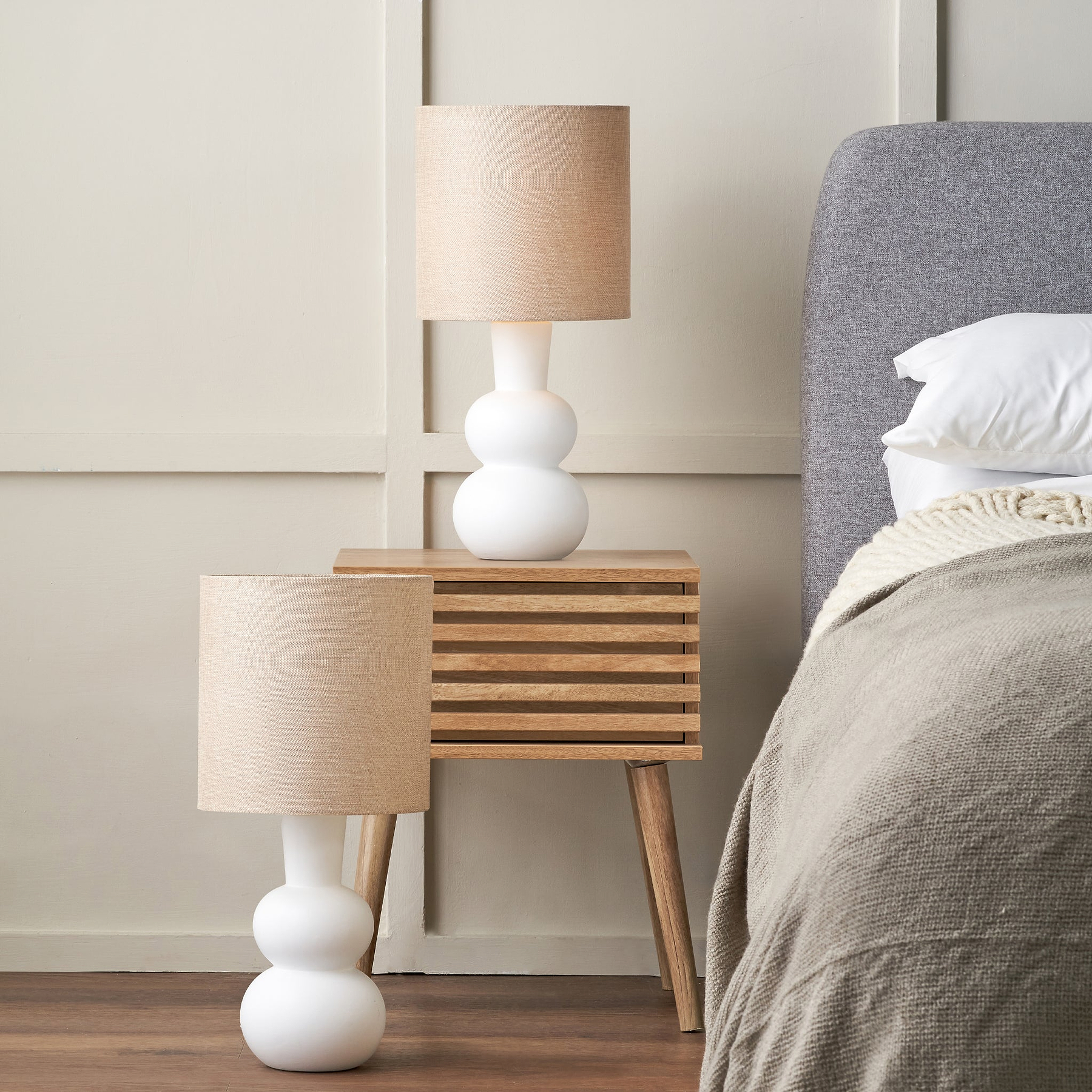 Aaliyah Curved Bottle Ceramic Table Lamp White from Roseland Furniture