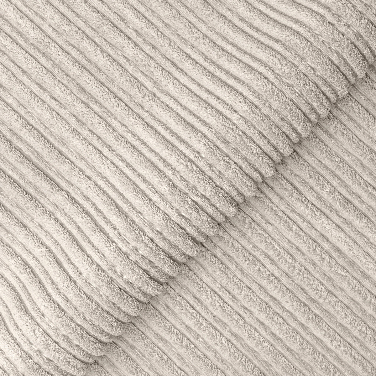 This is a grayscale image of parallel, ribbed textures intersecting diagonally, creating a pleated pattern with a tactile appearance.