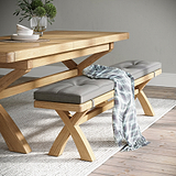 Portland Oak 200cm Cross Legged Dining Bench with beige cushion