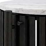 Close-up of Shorwell Black & Marble 1 Door Side Table with a white marble top and a dark charcoal black slatted base with a round metal pull handle.