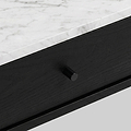Close-up of a modern Shorwell Black & Marble 1 Drawer Oval Coffee Table drawer with a black wood finish and a small round black knob, set beneath a white marble top with gray veining.