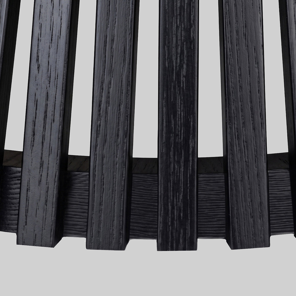 Close-up of a Shorwell Black & Marble 80cm Round Coffee Table slatted panel design with vertical blackened wood bars, shown against a plain light gray background.