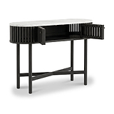 A modern Shorwell Black & Marble Oval Console Table with a black slatted frame, black legs, and a white marble top, shown with one side cabinet door open to reveal storage space.
