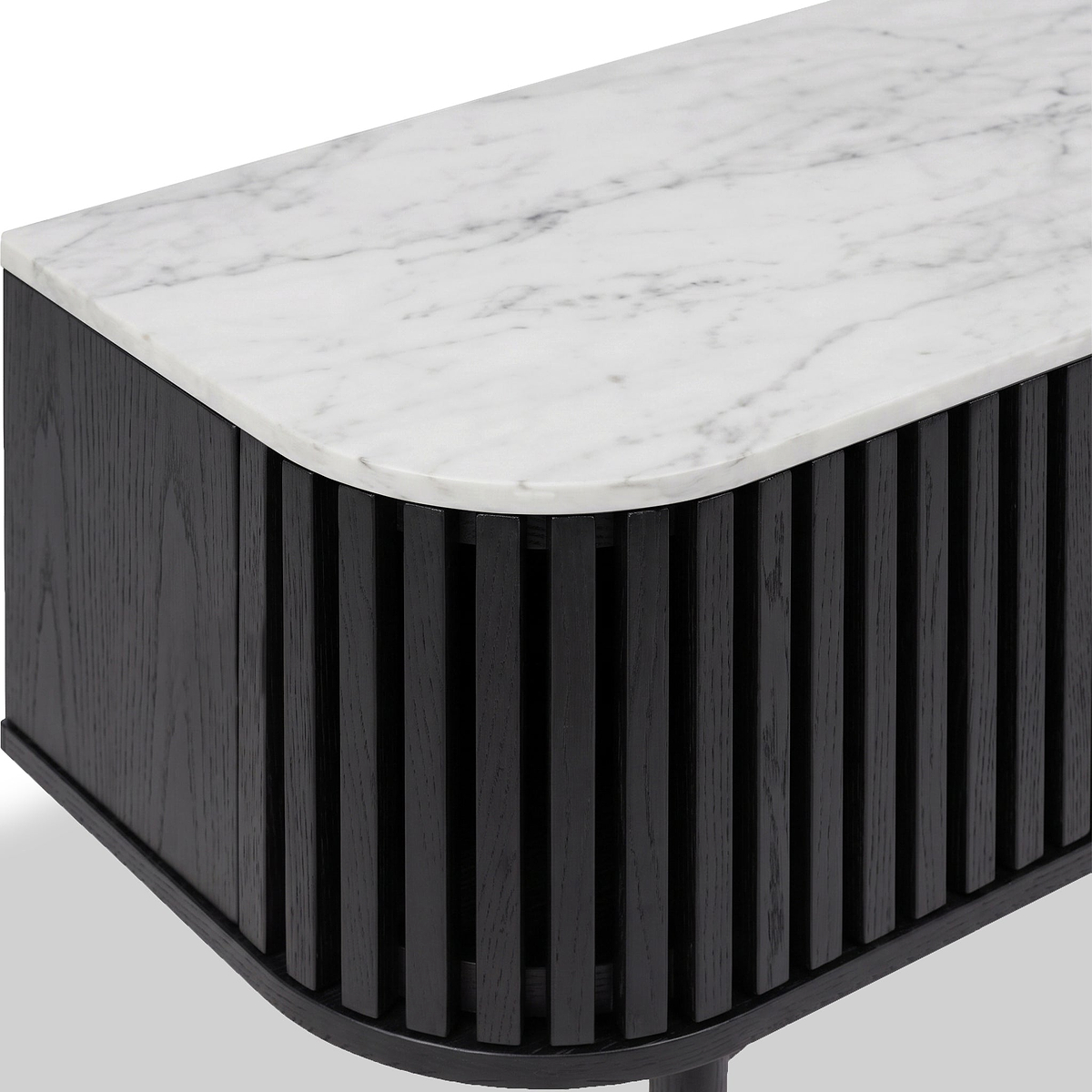 Close-up of a Shorwell Black & Marble Slatted 130cm TV Unit with a white marble top and a black slatted wooden side panel, shown on a light gray background.