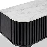 Close-up of a Shorwell Black & Marble Slatted 130cm TV Unit with a white marble top and a black slatted wooden side panel, shown on a light gray background.