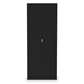 A tall black wardrobe stands with closed doors and a single gold-colored handle, isolated against a white background.