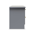 A grey, freestanding pedestal with a flat top, gold handles, and a drawer slightly ajar, isolated against a white background.